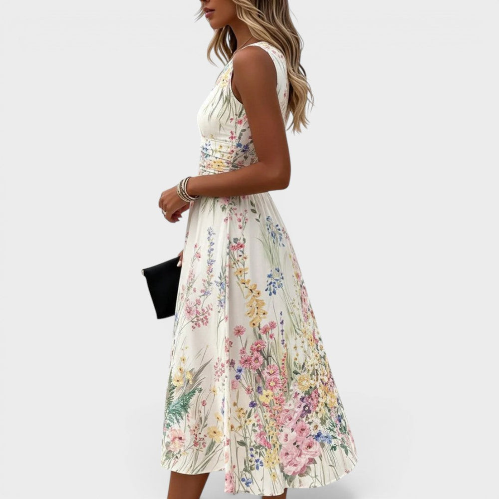 Floral watercolor midi dress, sleeveless with fitted bodice and flared skirt, side view