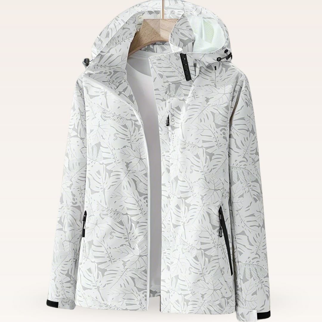 Women’s waterproof hooded jacket in white with leaf print, full zip and side pockets