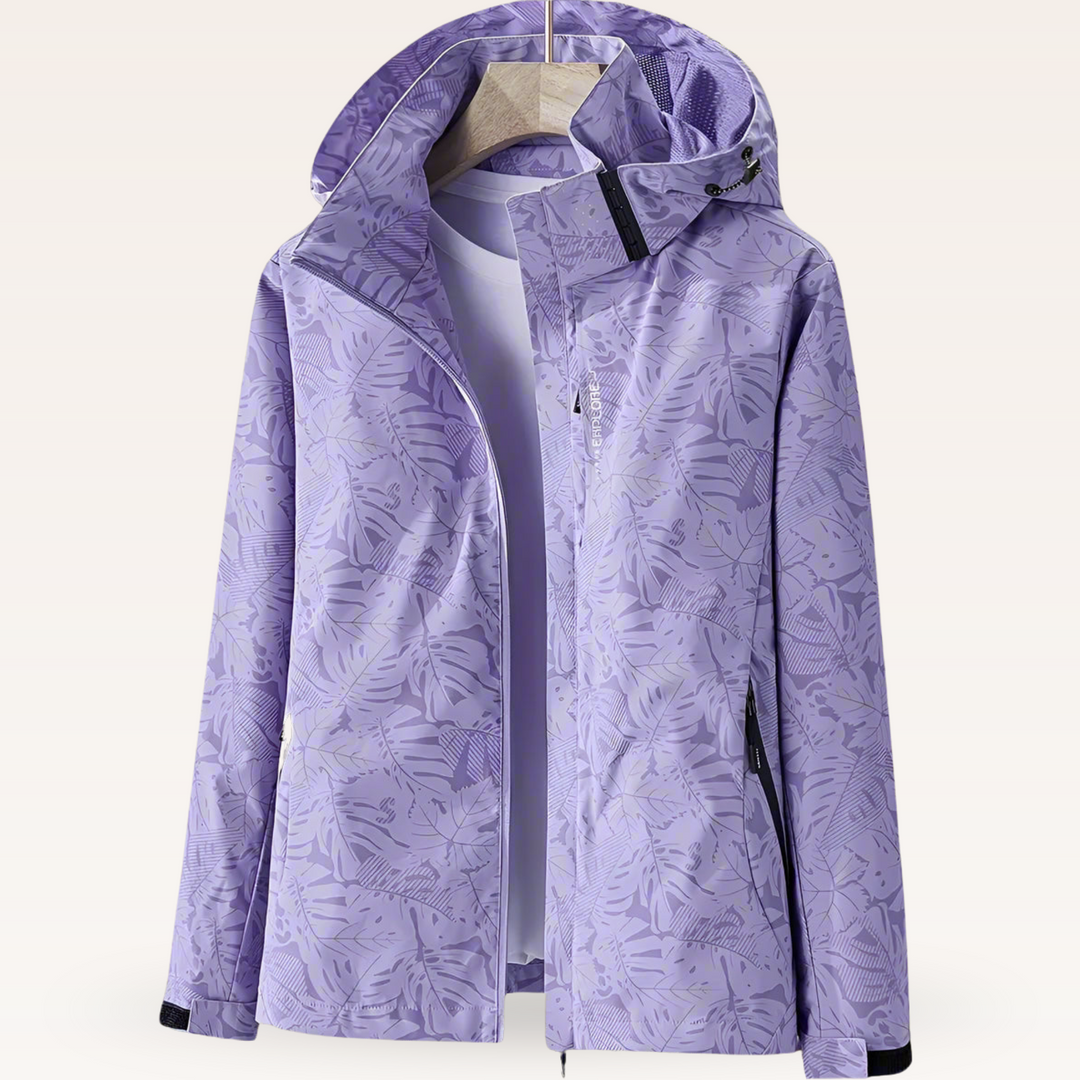 Women’s waterproof hooded jacket in lavender purple with leaf print, full zip and side pockets