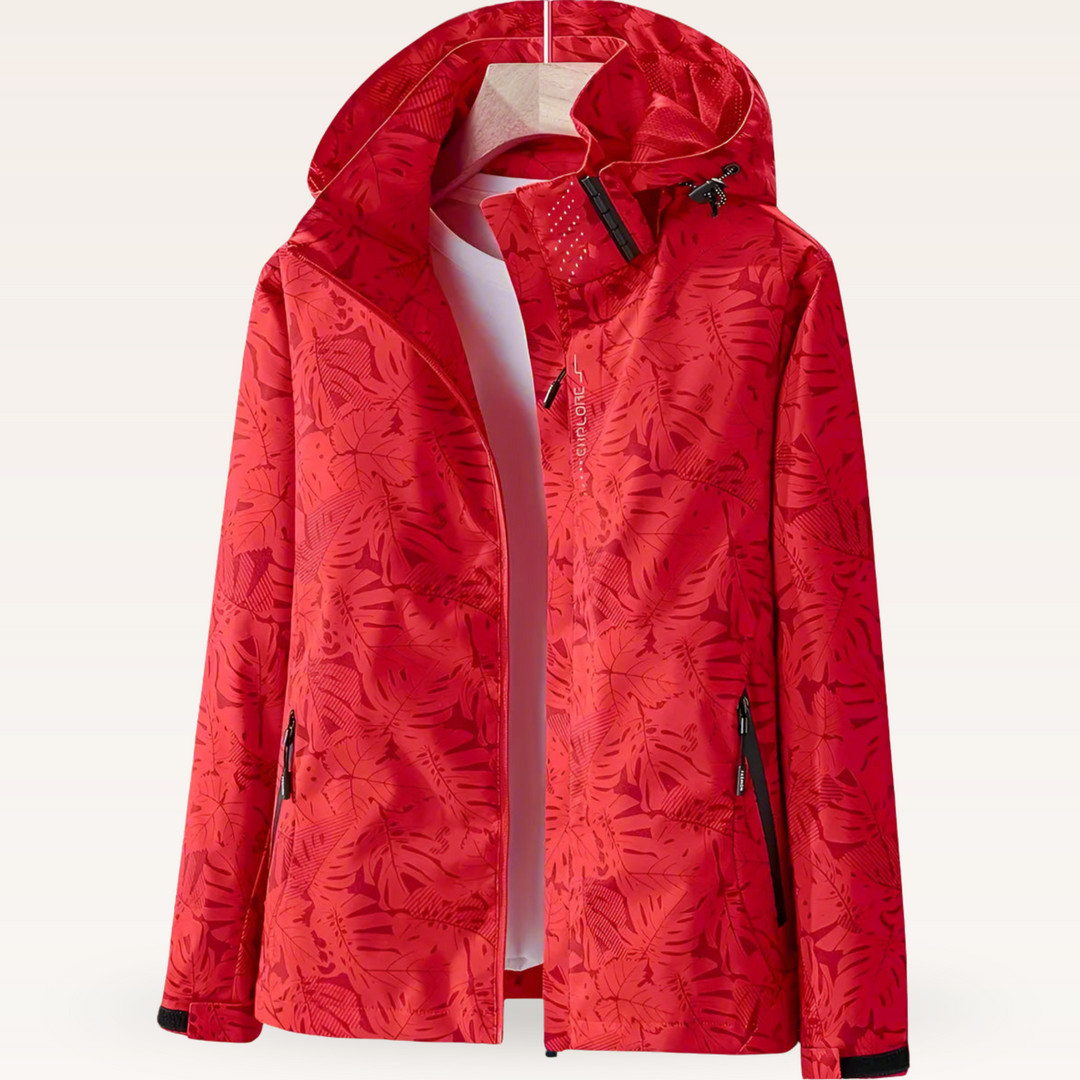 Women’s waterproof hooded jacket in red with leaf print, full zip and side pockets