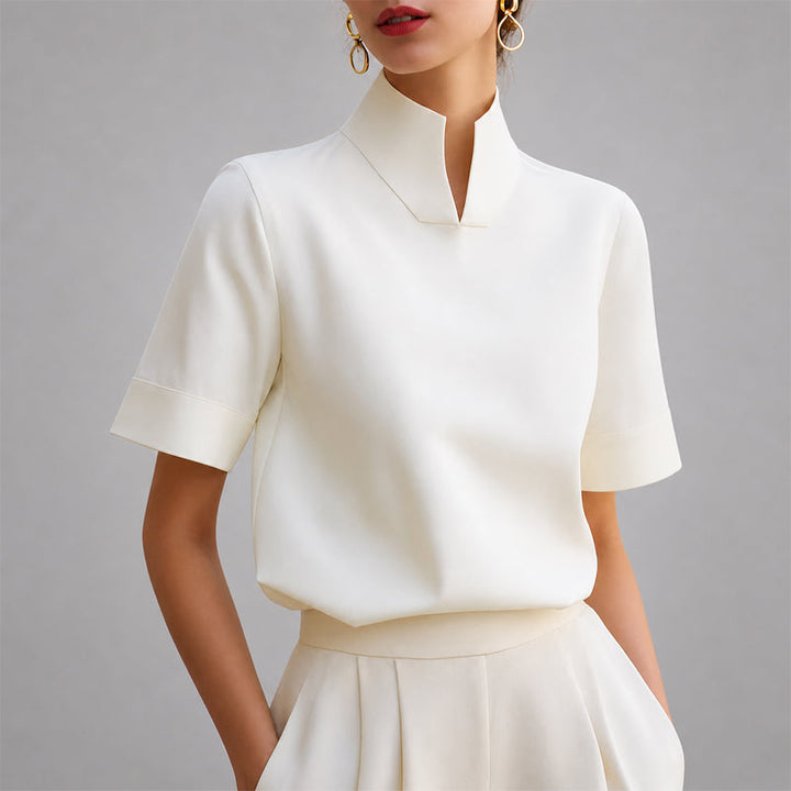 White structured mock-neck V-cut blouse with short sleeves