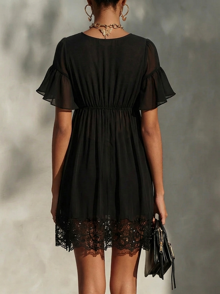 Black mini dress with lace trim, zip fastening, V-neck