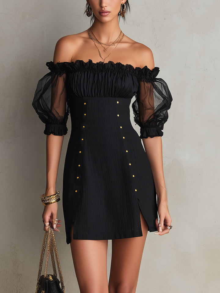 Black mini dress with puff sleeves and studs on the shoulders
