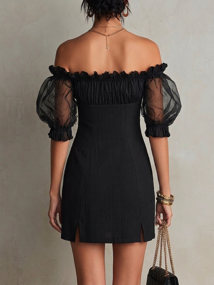 Black mini dress with puff sleeves and studs on the shoulders