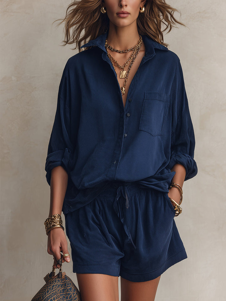 Set consisting of a loose navy blue shirt with pockets and shorts with a drawstring