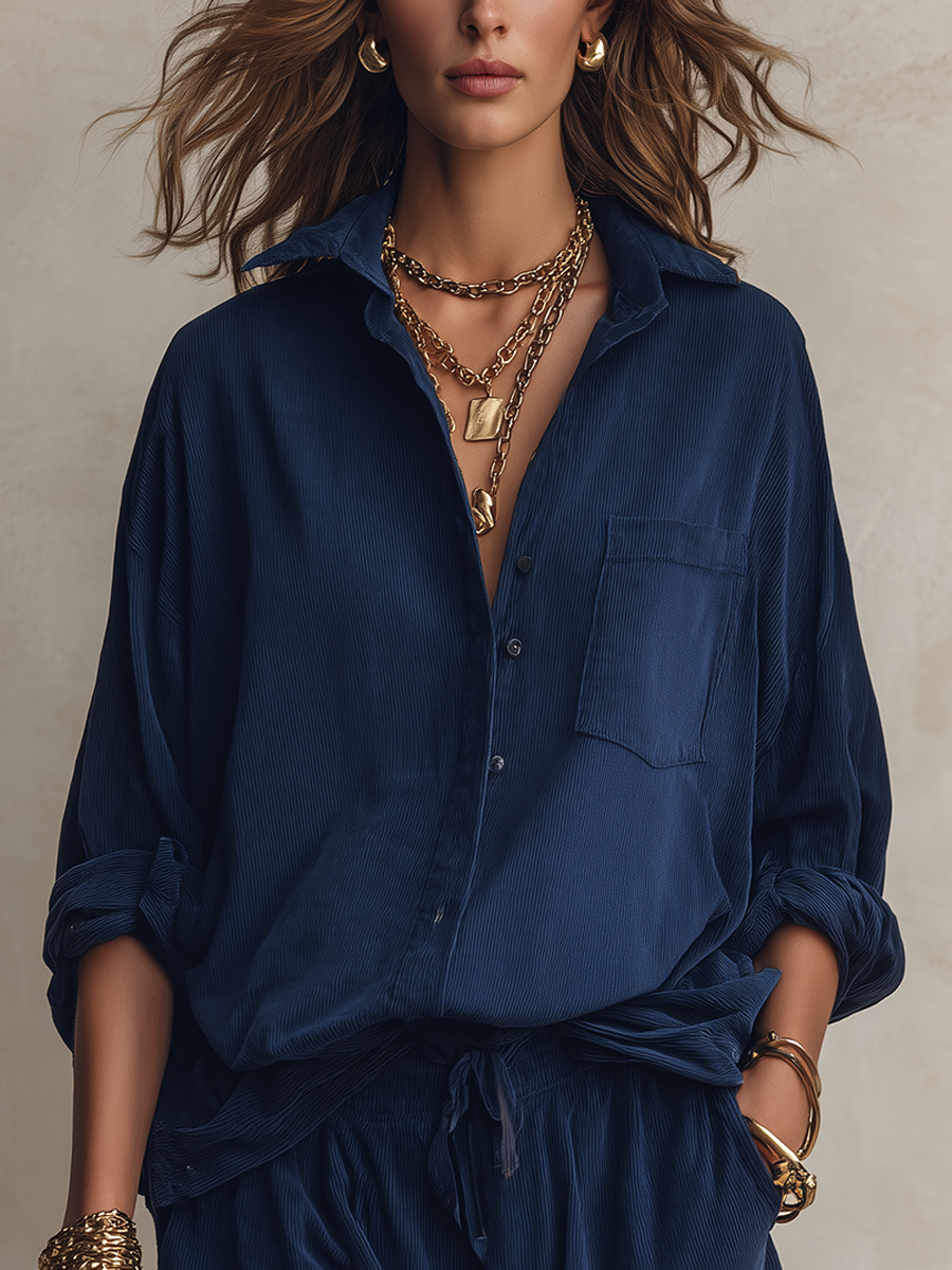 Set consisting of a loose navy blue shirt with pockets and shorts with a drawstring