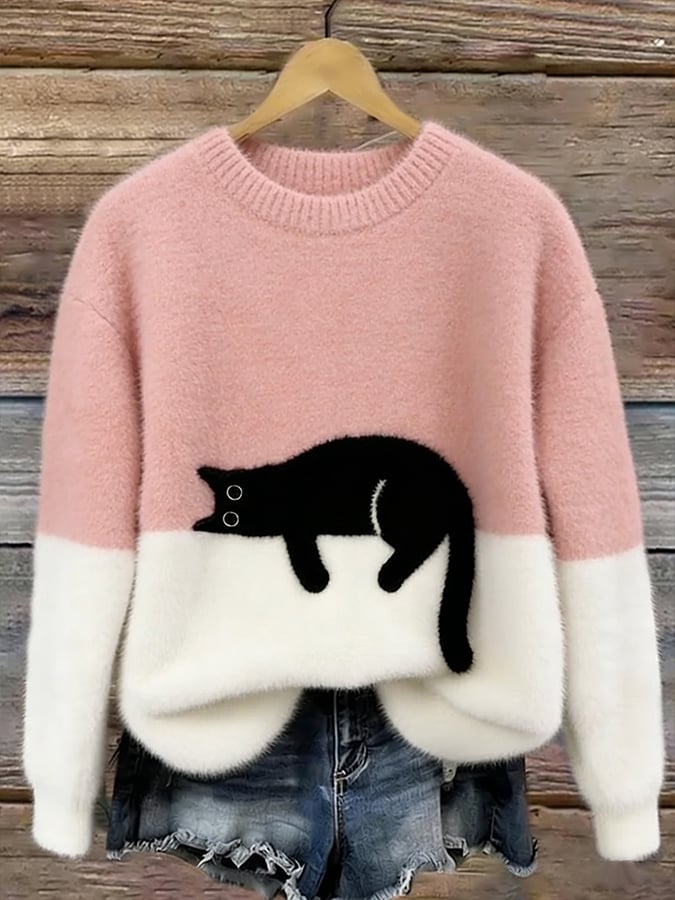 Lottie cozy oversized sweater in pink with white hem and black-and-white penguin graphic