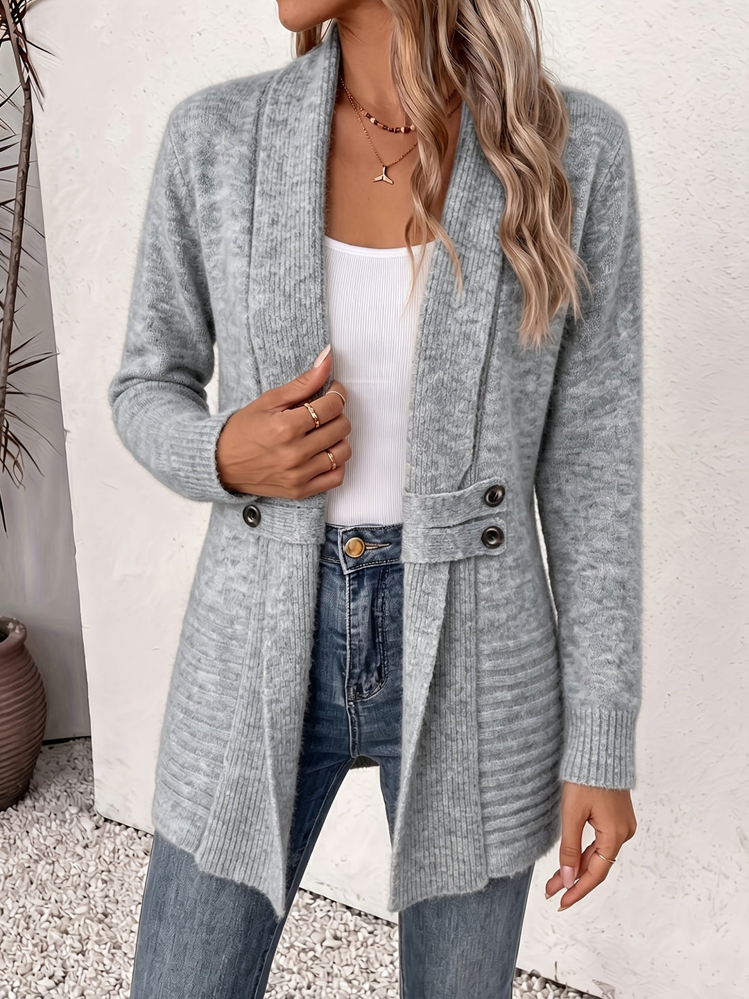 Gray knit ladies cardigan, open front with two-button placket and side pockets.