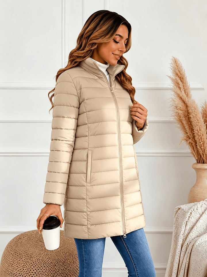 Lightweight quilted coat with stand collar and double zip front, beige puffer jacket.