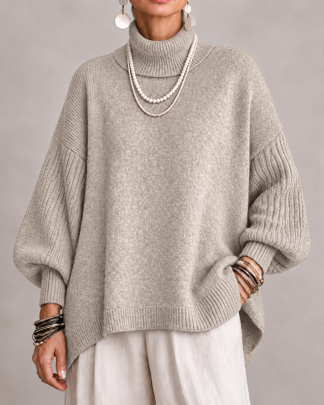 Beige turtleneck knit sweater with relaxed wide sleeves