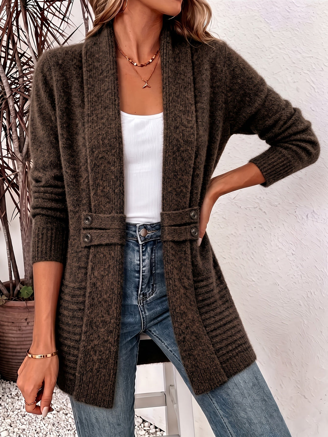 Coffee-brown knit ladies cardigan, open front with two-button placket and side pockets.
