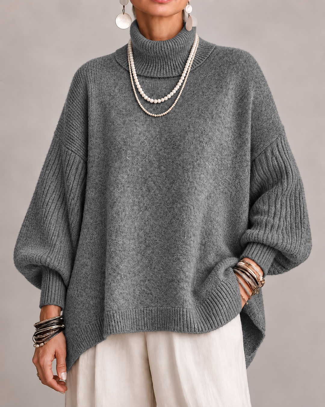 Dark gray turtleneck knit sweater with relaxed wide sleeves