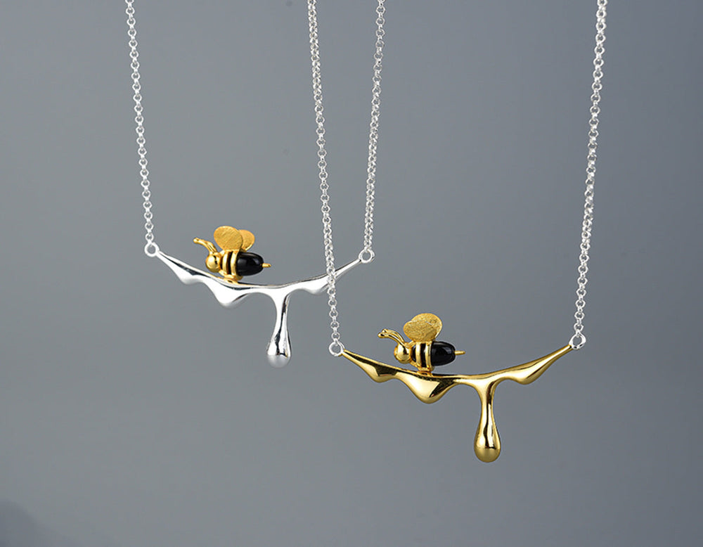 Silver dripping honey and bee pendant necklace with link chain, two pendants shown