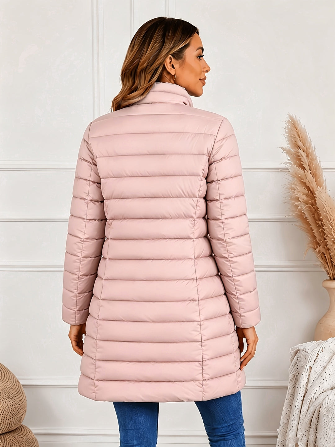 Lightweight quilted coat with stand collar and double zip front, pink puffer, back view.