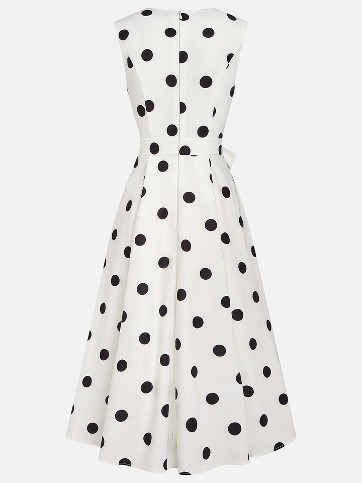 Black and white classic midi dress with polka dots and French sleeves