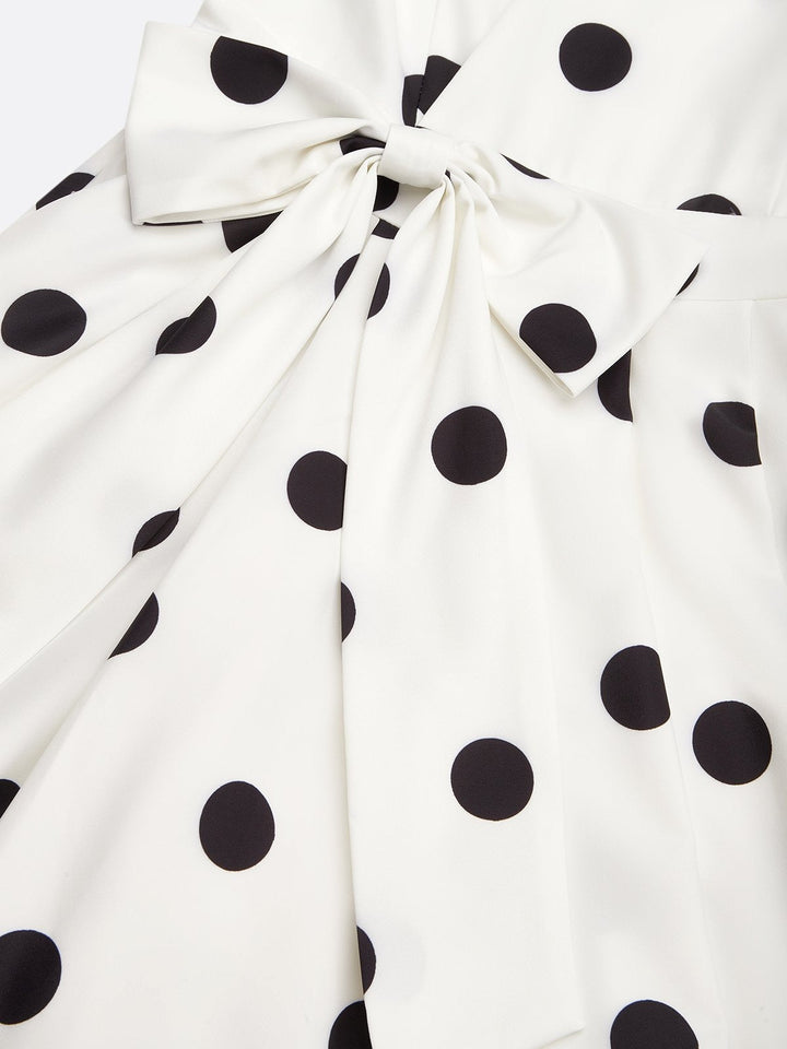Black and white classic midi dress with polka dots and French sleeves