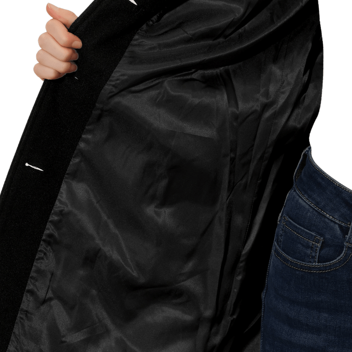 Black coat interior lining close-up with button placket edge
