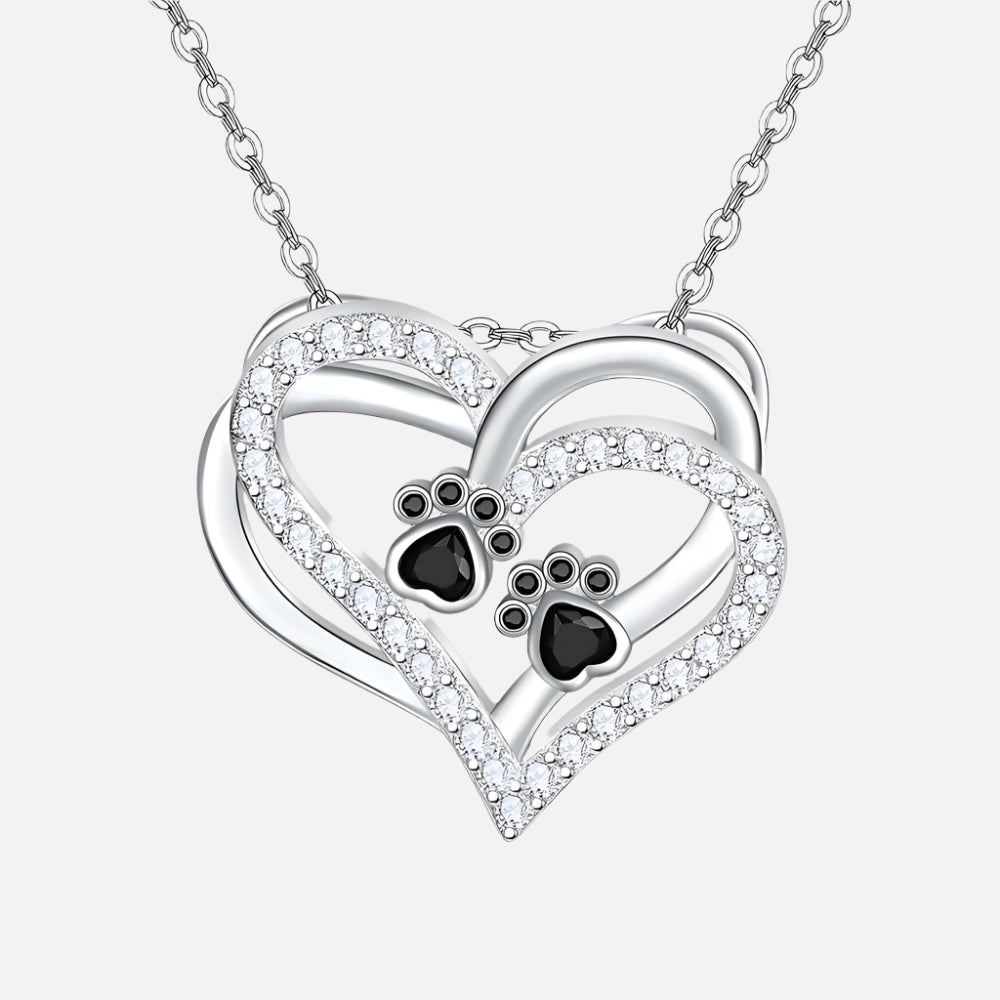 Silver heart pendant necklace with two paw-print details and clear zirconia border
