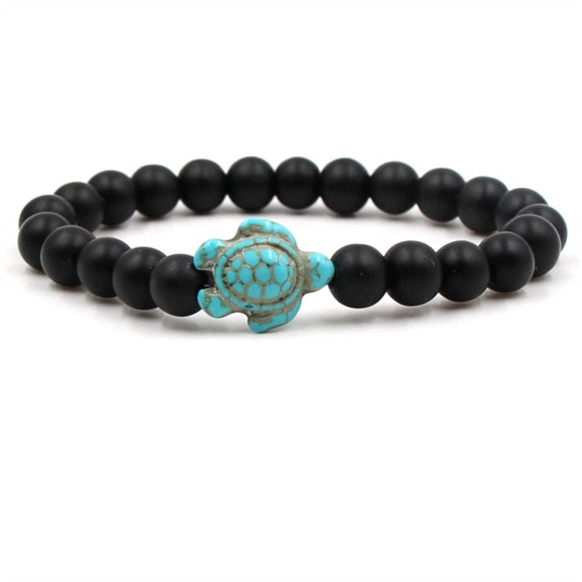 Black bead turtle bracelet with turquoise tortoise-style clasp centerpiece