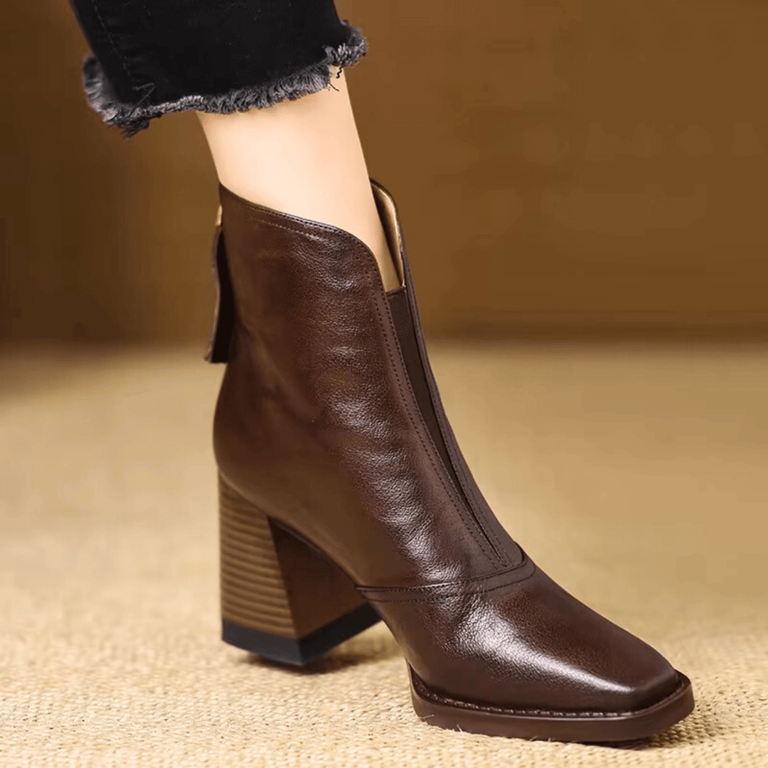 Brown faux leather ankle boots with mid block heel, pointed-toe pull-on design