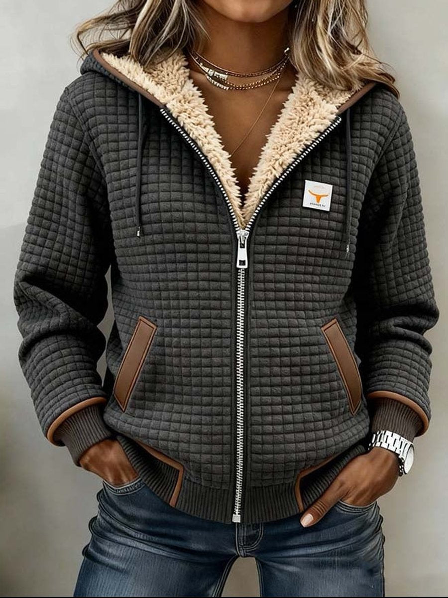 Sherpa-lined quilted zip-up hooded jacket in dark gray with tan leather-like pocket tabs