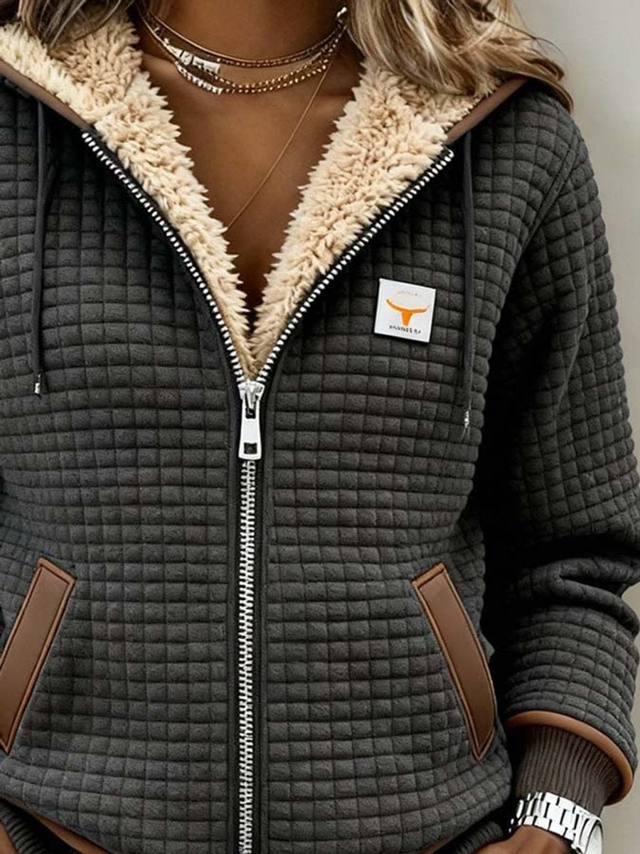 Quilted zip-up hooded jacket with sherpa fleece lining, tan trim, front view